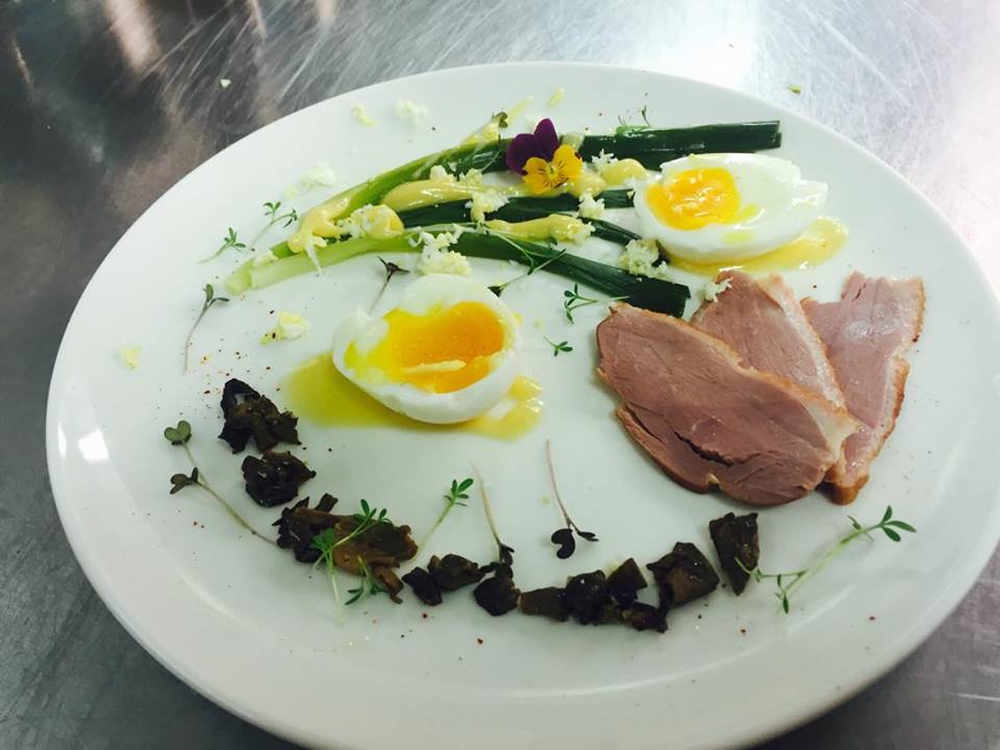 Soft boiled egg, smoked duck, morels bits and baby ieeks in a lemon butter sauce, served cold