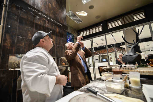 Patrick Guinness making pizza