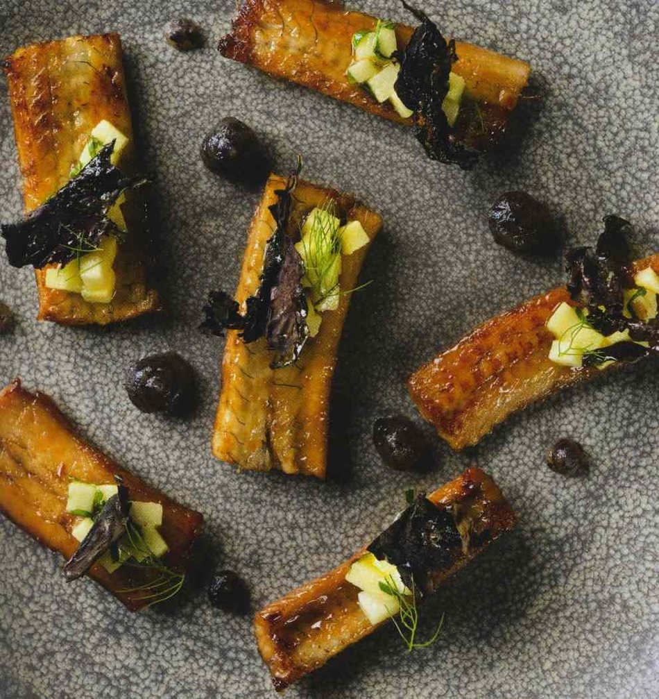 Cider glazed eels with apple and dulse butter, crystallised dulse, and apple and soup celery dressing