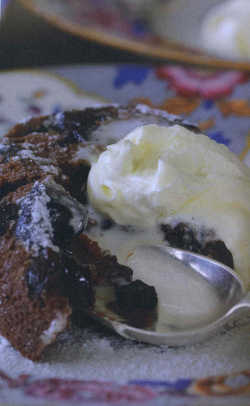 Chocolate, prune and Armagnac puddings with chocolate sauce