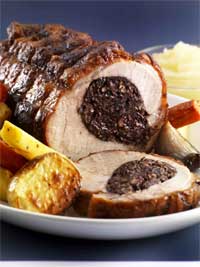 Roast Loin of Pork with Black Pudding Stuffing, served with Roasted Vegetables & Apple Sauce from Rolys Cafe & Bakery Cookbook